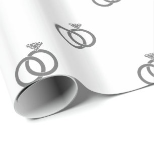 Grey Wedding Rings on White Wrapping Paper