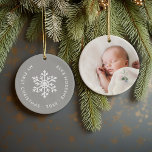 Grey Winter Snowflake First Christmas Keepsake Ceramic Tree Decoration<br><div class="desc">Ceramic holiday ornament personalised with your baby's photo and custom "My First Christmas" text. This simple modern holiday design features a white snowflake on a grey background. Use the design tools to choose any background colour, edit text fonts and colours and add your own photos to create your own unique...</div>