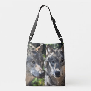 Grey Wolves in the Wild Crossbody Bag