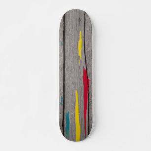 Grey Wood Slats with Yellow Red and Blue Paint Skateboard
