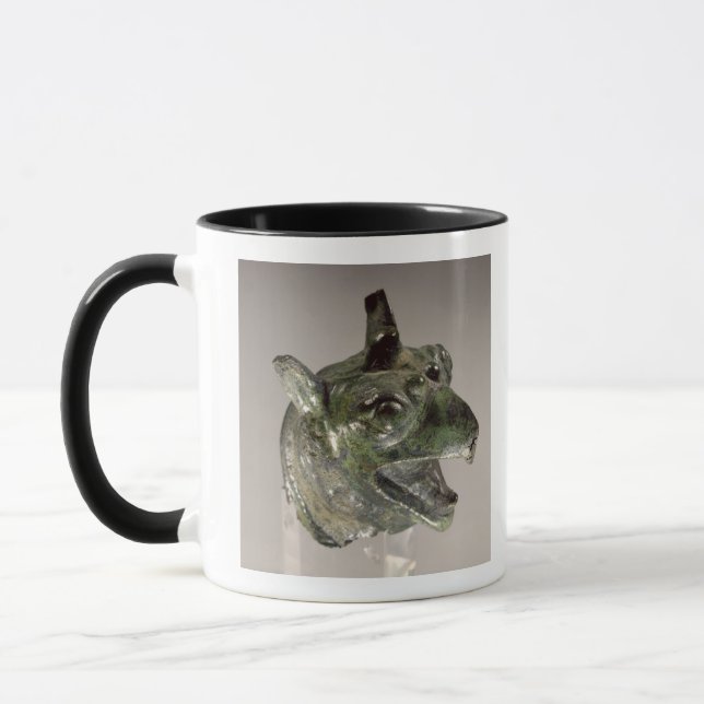 Griffin head, fragment of a cauldron attachment, f mug (Left)