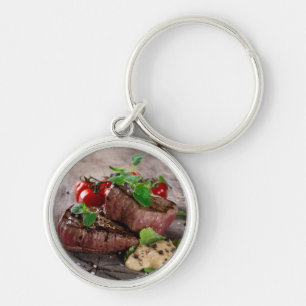 Grilled bbq steaks with fresh herbs and tomatoes key ring