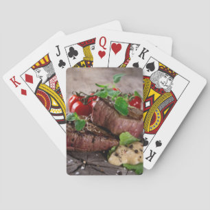 Grilled bbq steaks with fresh herbs and tomatoes playing cards