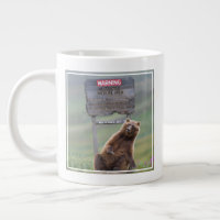 Grizzly Bear Plays With Sign