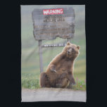 Grizzly Bear Plays With Sign Tea Towel<br><div class="desc">Grizzly bear scratches a roadside sign in Sable Pass,  Denali National Park,  Alaska</div>