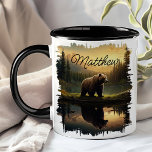 Grizzly Bear Sunset Lake Reflection Mug<br><div class="desc">Enjoy your favourite beverage with the Grizzly Bear Sunset Lake Reflection Mug. This unique mug features a stunning design of a grizzly bear by a serene lake at sunset, with the golden hues and majestic forest beautifully reflected in the water. Customised with your name, it adds a special touch that...</div>
