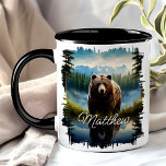 Grizzly Bear Wilderness Mug<br><div class="desc">Enjoy your favourite beverage with the Grizzly Bear Wilderness Mug. This unique mug features a stunning design of a grizzly bear in a serene wilderness setting, with mountains and forests reflected in a tranquil lake. Customised with your name, it adds a special touch that makes it uniquely yours. Made from...</div>