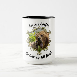 Grizzly bear with her baby in the forest.gold mug