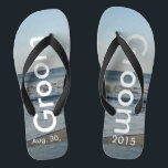 Groom Ocean Waves Beach Sand Jandals<br><div class="desc">Pretty Blue Sky with Light Fluffy White Clouds, Blue Sea, Crashing Ocean Waves and Beach Sand. Unisex Flip Flops with Groom and Date of Marriage written in a white colour text. PERSONALIZE with your Wedding DATE (or delete text). The wedding date is written in the sand. Shown with Wide Black...</div>