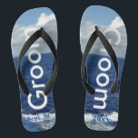 Groom Ocean Waves Blue Sky Jandals<br><div class="desc">One-of-a-kind Groom flip flops custom designed. Pretty Blue Sky with Fluffy White Clouds, Blue Sea and White Foam Ocean Waves. Unisex Flip Flops with Groom written in light silver text, and Date of Marriage in blue text. PERSONALIZE with your Wedding DATE (or delete text). Shown with Wide Black Straps and...</div>
