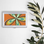 Groovy 60s 70s Hippie Flower Orange Retro Daisy Business Card Holder<br><div class="desc">This orange, retro design boasts a kaleidoscope of warm, earthy tones that epitomise the essence of the ‘60s and ‘70s, inviting you to the world that’s nothing short of groovy. It features a hypnotic, flower-inspired motif that radiates outward in a dazzling display of oranges, yellows, and greens, turquoises reminiscent of...</div>