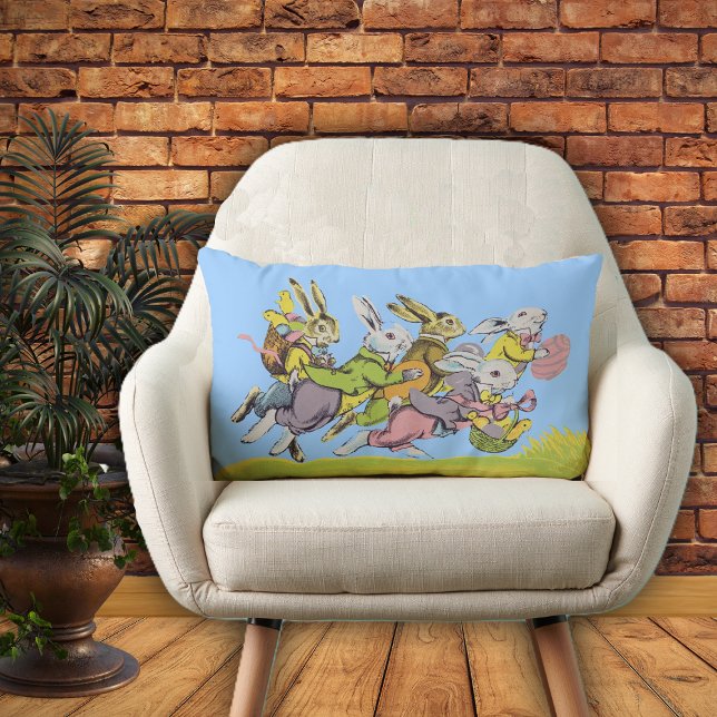 Group of Easter Rabbits Pastel Clothing in Grass Lumbar Cushion (Easter rabbits in pastel clothes eggs baskets running in grass on blue decorative pillow.)