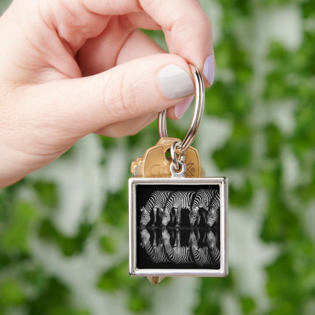 Group of Plains Zebra Drink Together at Night Key Ring (Hand)