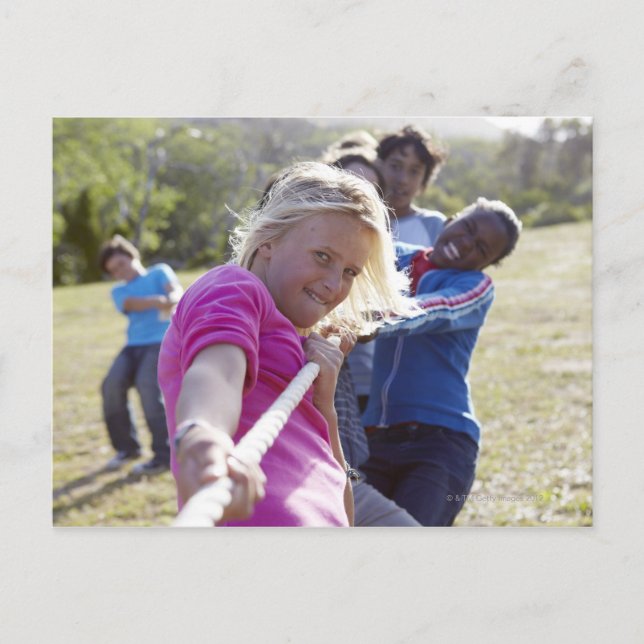 Group of teenagers, aged 13,  pulling together postcard (Front)