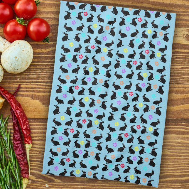 Group Spring Black Sitting Rabbits Flowers on blue Tea Towel (Black Silhouette sitting rabbits colourful flowers on light blue kitchen towel.)