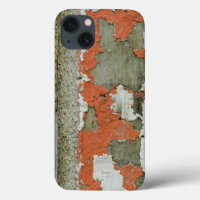 Grunge peeling orange paint on concrete wall