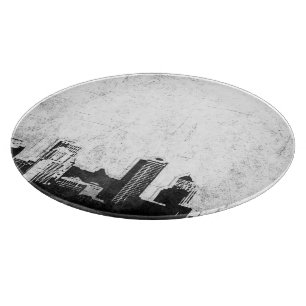 Grungy city background in black and white cutting board