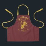 GRYFFINDOR™ Determination Courage Bravery Crest Apron<br><div class="desc">Show your house pride with this bold Gryffindor™ crest design, celebrating the values that define the bravest of witches and wizards. Featuring the iconic lion standing proudly before a shield, this striking artwork highlights Gryffindor’s core traits — Courage, Determination, and Bravery — in a powerful, vintage-inspired layout. The rich house...</div>