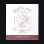 GRYFFINDOR™ Determination Courage Bravery Crest Notepad<br><div class="desc">Show your house pride with this bold Gryffindor™ crest design, celebrating the values that define the bravest of witches and wizards. Featuring the iconic lion standing proudly before a shield, this striking artwork highlights Gryffindor’s core traits — Courage, Determination, and Bravery — in a powerful, vintage-inspired layout. The rich house...</div>