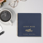 Guest book birthday dark blue script<br><div class="desc">A guest book for a 50th (or any age) birthday party.  A dark blue background. Add your name,  age,   date. The name is written with a modern hand lettered style script.   Golden text.</div>