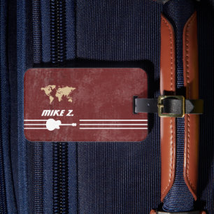 Guitarist traveller name on aged red luggage tag