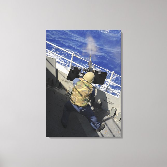 Gunners Mate firing a 50 calibre machine gun Canvas Print (Front)