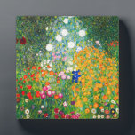 Gustav Klimt Flower Garden Plaque<br><div class="desc">Gustav Klimt Flower Garden plaque. Oil painting on canvas from 1907. Completed during his golden phase, Flower Garden is one of Klimt’s most famous landscape paintings. The summer colours burst forth in this work with a beautiful mix of orange, red, purple, blue, pink and white blossoms. A great gift for...</div>