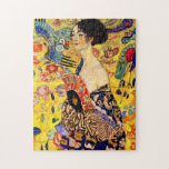 Gustav Klimt Lady with Fan Jigsaw Puzzle<br><div class="desc">Puzzle featuring Gustav Klimt’s oil painting Lady with Fan (1918). A woman wearing a blue kimono holds a red fan against a colourful yellow background of flowers and peacocks. A great gift for fans of Japonisme and European art.</div>