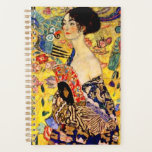 Gustav Klimt Lady with Fan Planner<br><div class="desc">Planner featuring Gustav Klimt’s oil painting Lady with Fan (1918). A woman wearing a blue kimono holds a red fan against a colourful yellow background of flowers and peacocks. A great gift for fans of Japonisme and European art.</div>