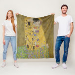 Gustav Klimt The Kiss Classic Painting Fleece Blanket<br><div class="desc">Gustav Klimt's "The Kiss" is undoubtedly one of the most iconic and revered paintings of the early 20th century, epitomising the Art Nouveau movement with its intricate details and gold leaf accents. The artwork depicts a loving couple, a man and a woman, locked in a tender kiss against a backdrop...</div>