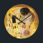 Gustav Klimt The Kiss Classic Painting Round Clock<br><div class="desc">Gustav Klimt The Kiss Gustav Klimt used real gold in his beautiful work of art nouveau women and decorative art. This Klimt painting was called "The Kiss" and is the most well-known art nouveau work he ever painted. The Gustav Klimt painting is of an art nouveau woman and man in...</div>