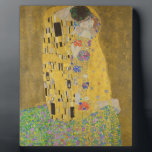 Gustav Klimt "The Kiss" Plaque<br><div class="desc">Gustav Klimt 's masterpiece: "The Kiss". “The Kiss, ” created by the Austrian painter Gustav Klimt. It’s considered to be his most famous work. He painted it between the years 1907 and 1908, which were the highpoint of his “Golden Period, ” when he painted a number of works utilising gold...</div>