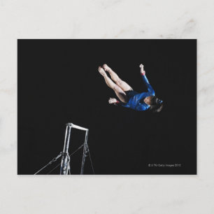 Gymnast (16-17) dismounting uneven bars postcard