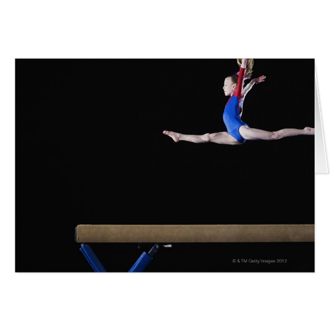 Gymnast (9-10) leaping on balance beam 2 (Front Horizontal)