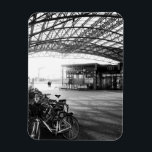 Halle Train Station, Belgium Magnet<br><div class="desc">The black and white urban image of Halle Train Station in Flemish Brabant, Belgium captures the timeless beauty of the modern architecture, with light and shadow creating a dramatic interplay. The parked bicycle and the wheels of vehicles add a sense of movement to the stillness of the scene, while the...</div>