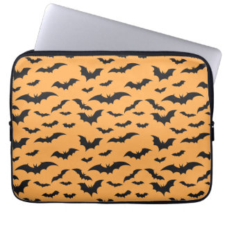 Halloween bats on orange background laptop sleeve