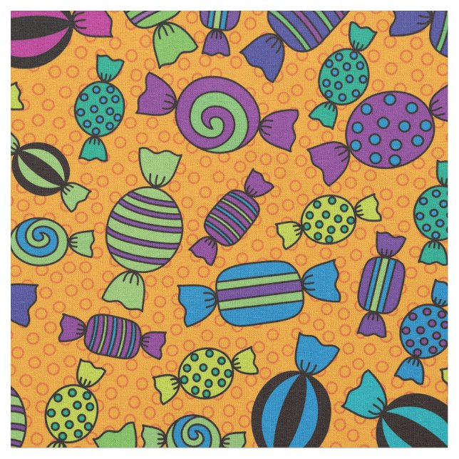Halloween Candy Treats on Orange Pattern Fabric (Close Up)