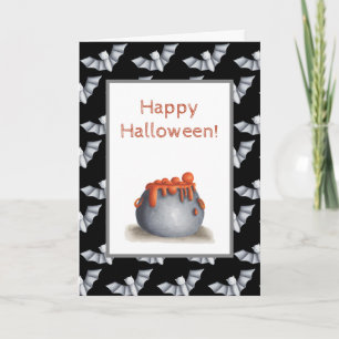 Halloween card with a cauldron and bat background