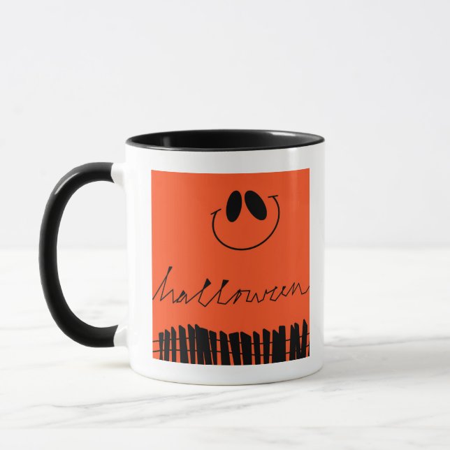 Halloween designs on orange mug (Left)