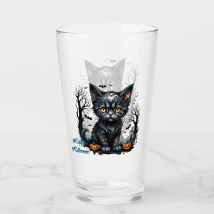 Halloween night with kitten and pumpkins. glass
