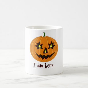 halloween pumpkin with candles inside coffee mug