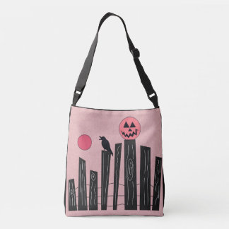 Halloween scene with fence, crow, full moon, & pum crossbody bag