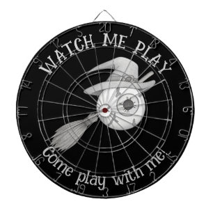 Halloween witch broom and scary eyeball dartboard