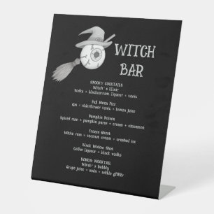 Halloween witch broom and scary eyeball pedestal sign