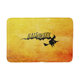 Halloween witch flying on a broomstick bath mat