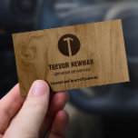 Hammer Logo Construction Handyman Carpenter  Business Card<br><div class="desc">This business card combines a rustic, professional design with practical information, making it a perfect tool to leave a lasting impression on your clients. The light wood texture and the hammer logo convey quality and reliability, while the detailed contact information and service list on the reverse side ensure your clients...</div>