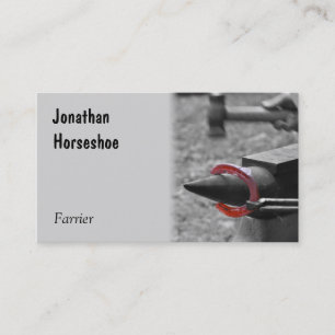 Hammering a red hot shoe on an anvil business card