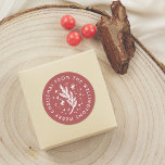 Hand-Drawn Pine & Snow Red Merry Christmas Classic Round Sticker<br><div class="desc">This fun and festive stickers feature the greeting of your choice and your custom family name written in round typography around the edge of the sticker. In the middle, there is a hand-drawn illustration of rustic pine, snow, and sparkles. The background is red and the text and drawing are in...</div>