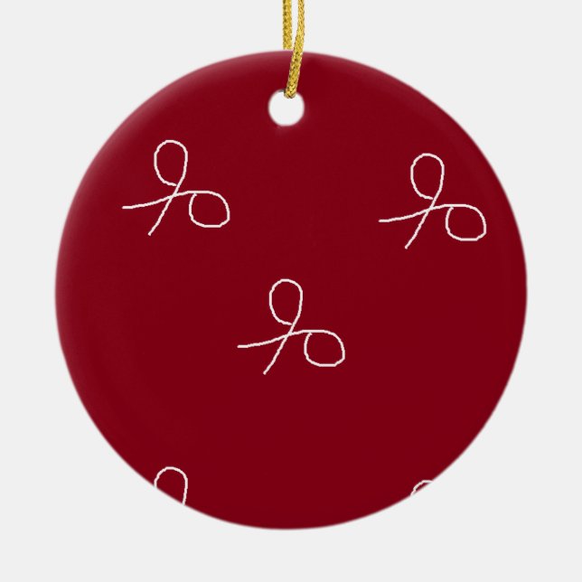 Hand drawn scissors on maroon red ceramic tree decoration (Front)