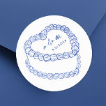 Hand Drawn Vintage Cake Blue Whimsical Wedding Classic Round Sticker<br><div class="desc">Personalised Vintage Cake Wedding Monogram Stickers. These custom round wedding stickers feature a simple vintage-style cake illustration at the centre, accented with elegant blue details and topped with the couple’s monogram initials and wedding date for a timeless and sophisticated touch. The minimalist design showcases a mix of classic serif and...</div>